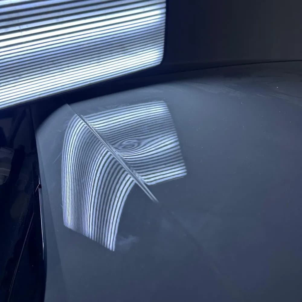 Capot, contrôle à la lampe — avant